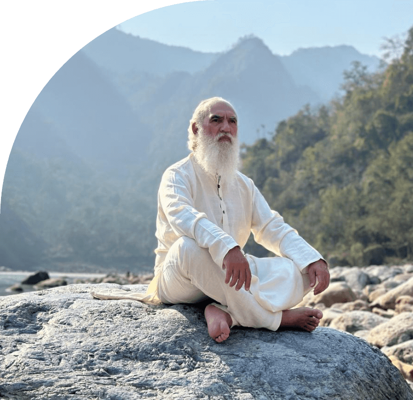 Sri Prem Baba sitted, mountain in the background